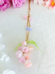 Elevate your style with our exquisite Handmade Shrink Plastic Crocus Necklace, a wearable work of art capturing the essence of delicate blooms. Crafted with meticulous attention to detail, each pendant showcases the vibrant hues of crocus petals, making it a perfect accessory for nature enthusiasts and flower lovers alike. The lightweight and durable shrink plastic material ensure comfortable wear, while the intricate design adds a touch of whimsy to any outfit. This unique floral necklace is a testament to craftsmanship and creativity, making it an ideal gift for those who appreciate handmade, nature-inspired jewelry. Embrace the beauty of spring all year round with this stunning crocus necklace - a truly distinctive piece for your jewelry collection! Delicate Spring Jewelry With 3d Flowers, Spring Blossom Jewelry With Flower Decoration, Spring Blossom-colored Flower Decorated Jewelry, Delicate Spring Jewelry With Flower Decoration, Elegant Spring Flower Charm Necklace, Elegant Flower Necklace Spring Gift, Elegant Spring Flower Necklace As A Gift, Elegant Spring Flower Necklace As Gift, Elegant Spring Flower Necklace Gift