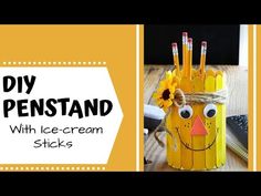 an easy diy pen stand made out of ice cream sticks and sunflowers