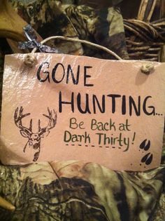 a sign that says gone hunting be back at dark thirty