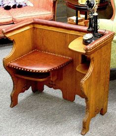 an old fashioned desk and chair in a room