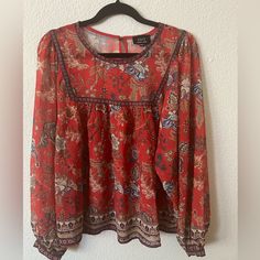 Woman’s Xl Red Floral Blouse. Never Worn Red Bohemian Tops For Fall, Red Bohemian Fall Blouse, Red Long Sleeve Blouse With Floral Print, Red Floral Print Tops For Fall, Long Sleeve Red Blouse With Floral Print, Fall Floral Print Red Top, Fall Red Floral Print Tops, Red Flowy Bohemian Blouse, Flowy Red Bohemian Blouse