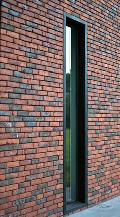 a red brick building with an open window