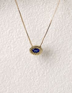 Solid gold necklace with sapphire pendant, inspired by the Evil Eye symbol. Solid gold Gemstone: Blue oval cut sapphire 3X4 mm | 0.1X0.15 inch Chain length: 42 cm | 16 inch Pendant size: 8x6 mm | 0.3x0.2 inch Packed in labeled gift box Feel free to contact me for details and special requests All items can be ordered in solid 14k/18k yellow, white or rose gold Please review terms and conditions before checkout For a matching ring: https://www.etsy.com/listing/572599973/sapphire-snake-ring-14k-gol Oval Sapphire Pendant, Gold Sapphire Necklace, Gold Sun Necklace, Wide Gold Ring, Necklace Sapphire, Sapphire Eyes, Sterling Silver Skull Rings, Element Necklace, Goth Earrings