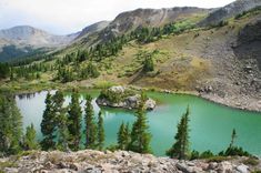 a mountain lake surrounded by trees and rocks