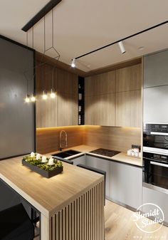 modern kitchen with wooden counter tops and stainless steel appliances, along with an island in the middle