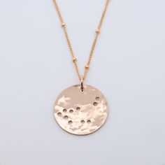 What's your sign? These sweet handmade zodiac necklaces are written in the stars, literally. Strung on a 18 inch chain in the metal of your choice, this coin has tiny dot zodiac star cut outs. Simply select your sign and we'll send you the stars. Need one for a friend? Take a peek at all twelve! 3/4”L Coin on a 18” Chain. Rose Gold Zodiac Sign Round Pendant Necklace, Rose Gold Zodiac Round Pendant Necklace, Rose Gold Zodiac Sign Necklace As Gift, Rose Gold Zodiac Sign Necklace For Gift, Nickel-free Rose Gold Round Charm Necklaces, Nickel-free Round Rose Gold Charm Necklaces, Rose Gold Zodiac Sign Jewelry For Gift, Dainty Zodiac Sign Round Necklace, Dainty Zodiac Sign Necklace