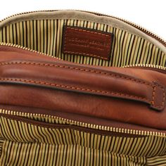 Experience the allure of our timeless leather toiletry bag by Tuscany Leather! This exquisite travel companion combines luxurious flair with eco-conscious craftsmanship, making it perfect for your journeys. Made from matte full grain hand stained vegetable tanned leather, this is not just a bag; it's a style statement. The cotton lining ensures your grooming essentials remain secure, while two spacious compartments and additional pockets help you stay organized. Its zip closure keeps everything Leather Travel Cosmetic Bag With Zipper, Leather Pouch Backpack With Leather Lining For Travel, Leather Pouch Backpack For Travel With Leather Lining, Classic Leather Cosmetic Bag For Everyday Use, Classic Leather Cosmetic Bag For Business, Classic Leather Cosmetic Bag With Removable Pouch, Brown Textured Leather Travel Bag, Travel Cosmetic Bag With Top Handle, Textured Saffiano Leather Travel Bag