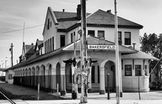 a black and white photo of a building with a sign that says bakerfield on it