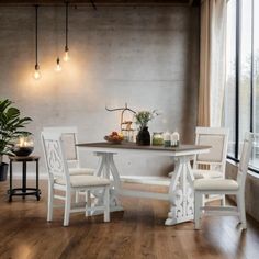 a dining table with four chairs and a bench