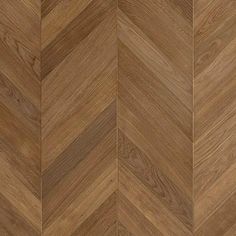 an image of wood flooring that looks like chevroned herringbones in brown