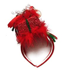 a red headband with feathers and beads on it's side, against a white background