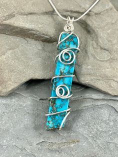 This turquoise blue sea sediment jasper necklace is gorgeous! it feature beautiful patterns in the stone with vibrant sky blue colors. This necklace is handmade from genuine smooth polished sea sediment jasper stone. I chose to enhance these beautiful stones with a simple swirling silver wire design to let the natural beauty of the gemstone shine. This necklace has a definite bohemian vibe. The stones measure approximately 10 x 60mm. These earrings are simply stunning and will get you compliment Bohemian Blue Turquoise Chrysocolla Necklace, Healing Blue Turquoise Necklace With Natural Stones, Bohemian Blue Chrysocolla Necklace, Adjustable Blue Turquoise Chrysocolla Necklace, Bohemian Blue Wire Wrapped Turquoise Necklace, Amazonite Necklace, Aquamarine Earrings, Jasper Necklace, Birthstone Gifts