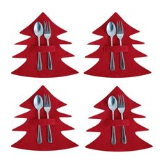 four forks and spoons are placed in the shape of christmas trees on red felt