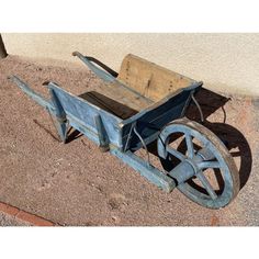 an old wooden wagon sitting on the ground