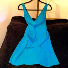 Nwt Alice + Oliva Turquoise, Silk Lined Dress, Size Small.Stunning And Big Sale! Gorgeous Dress That Could Be Worn In Many Occasions. It Could Be Dressed Up Or Down. It Is A Crisscross Teal Mini Dress That Is Lined With Silk In The Inside. This Dress Was Never Knew And Has The Tags. Message Me If You Have Any Questions The Measurements For The Dresser Found Below. Length: Width: Armpit To Armpit: Happy Poshing! Blue Silk V-neck Mini Dress, Blue Silk Mini Dress With V-neck, Elegant Turquoise Mini Dress, Elegant Sleeveless Turquoise Dress, Summer Cocktail Dress In Turquoise, Turquoise Summer Cocktail Dress, Elegant Turquoise Cocktail Dress, Turquoise Sleeveless Cocktail Dress, Turquoise Silk Dress For Spring