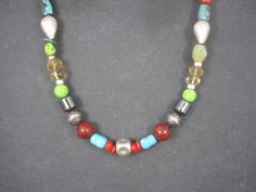 This gorgeous southwestern necklace features natural gemstone, crystal and sterling beads. The silver beads, end caps and clasp are all sterling silver. At its widest, this necklace measures 1/2 of an inch. The necklace is 17.5 inches from end to end. Marks: Sterling, Picto sun Condition: Excellent Bohemian Beaded Necklace With Sterling Silver Clasp, Bohemian Sterling Silver Beaded Necklaces With Large Beads, Bohemian Sterling Silver Necklace With Large Beads, Bohemian Sterling Silver Beaded Necklace With Large Beads, Southwestern Silver Gemstone Beads, Opal Cuff Bracelet, Southwestern Necklace, Inlay Jewelry, Turquoise Bead Necklaces