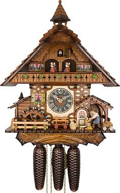 a large wooden cuckoo clock with figures on it