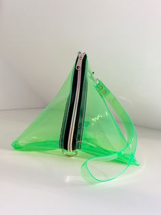 a small green bag with a zipper on it