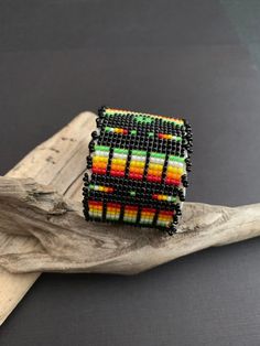 "Native America Indian Jewelry. This is a stunning fully beaded Navajo bracelet. Made by hand from a Navajo family of women that do spectacular beadwork in a wide variety of items. This beautiful bracelet is 1.50\"x 6\" end to end with a 1.25\" opening, white leather over playable metal. This is a gorgeous colorful bracelet that will look fabulous on everyone! Please look closely at photos. Welcome to NorthWestTradingCo" Black Beaded Bohemian Cuff Bracelet, Black Bohemian Cuff Bracelet With Round Beads, Black Beaded Southwestern Bracelets, Southwestern Black Beaded Bracelets, Handmade Black Southwestern Beaded Bracelets, Handmade Southwestern Black Beaded Bracelets, Southwestern Style Black Beaded Bracelets, Southwestern Black Beaded Bracelet With Colorful Beads, Southwestern Style Black Beaded Bracelet With Colorful Beads