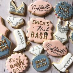 decorated cookies are arranged on a wooden table