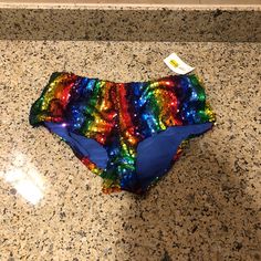 Shine Bright With This **Rainbow-Colored Sequined Women's Bottom**The Ultimate Statement Piece For Raves And Nights Out! Brand New With Tags, This Dazzling Bottom Features A Vibrant Array Of Sequins That Catch The Light From Every Angle, Ensuring You Stand Out In Any Crowd. The Playful Rainbow Pattern Adds A Fun, Festive Vibe, Making It Perfect For Parties, Festivals, Or Any Occasion Where You Want To Sparkle. Comfortable And Eye-Catching, This Piece Is A Must-Have For Those Who Love To Express Rainbow Shorts, Rave Bottoms, Vibrant Style, Rainbow Pattern, Rave Outfits, Shine Bright, Rainbow Colors, Womens Bottoms, Night Out