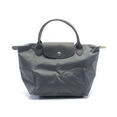 Used Longchamp Le Pliage Green S Tote Bag Nylon Leather Women's Gray L1621919p66 (Sku: Gzl13xj3) === General === Brand : Longchamp === Design === Type : Tote Bag Material : Nylon , Leather Color : Gray Gender : Women === Size === Size (Hxwxd) : 22cm X 22cm X 14cm / 8.66'' X 8.66'' X 5.51'' === Included Items === Accessories : None Accessories Notice : Before Purchasing, Please Refer To The Images Of The Accessories Included With The Item. === Condition === Condition : New Ranking : Rank N New / Longchamp Le Pliage Filet Knit Bag, Longchamp Le Pliage Large Travel, Longchamp Le Pliage Green, Nylon Bag, Longchamp Le Pliage, Luxury Branding, Leather Women, Bags Handbags, Dust Bag