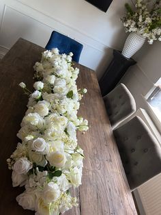 a long table with white flowers on it