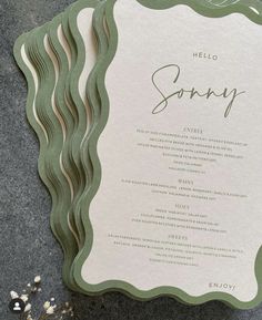 a green and white menu card with the word sorry on it