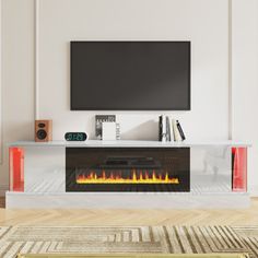 a living room with a television and fire place in the center, on top of a wooden floor