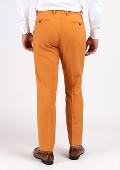 With a mustard-hue and stretch cotton fabric, you'll feel comfortable and stylish all day long in this unique custom made pants. Stand out and enjoy the compliments! Tailored Brown Cotton Pants, Fitted Brown Cotton Pants, High-waisted Cotton Chinos, Fitted High-waisted Cotton Chinos, Fitted Orange Elastane Bottoms, Fitted Orange Straight Pants, Fitted Orange Ankle-length Pants, Fitted Mustard Bottoms For Workwear, Mustard Fitted Bottoms For Workwear