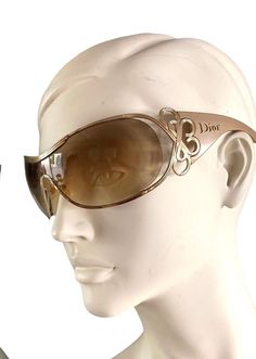 Dior Diori mask sunglasses with taupe resin frames and brown ombre lenses with a gold metal curlicue and the Dior name on the arms. Pre-worn, in very good condition: light scuffing on the lenses but does not impede visibility. Does not come with original case. Made in Italy. Guaranteed authentic. + Vintage items are not new and might have minor imperfections + Will be sent insured and tracked + International orders, PLEASE INCLUDE PHONE NUMBER AND EMAIIL. Buyer is liable for any import duties / taxes. :: Follow us on Instagram for sneak peeks & updates: vintagestarparis :: Dior Sunglasses Women, Galliano Dior, Mask Sunglasses, Wrap Sunglasses, Yellow Sunglasses, Stylish Glasses, Dior Sunglasses, Brown Ombre, Shield Sunglasses