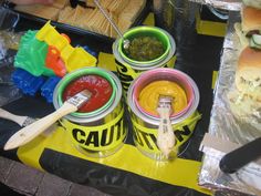 there are some food on the table with plastic containers