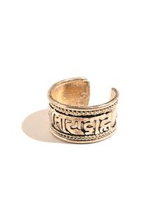 This adjustable ring is hand crafted by local artists of Katmandu Nepal. It features the well known and beloved Tibetan holy mantra Om Mani Padme Hum artfully carved around the band, with a delicate ropelike design around both sides. The ring can be gently pressed together to adjust to whichever finger on which you choose to wear it. Wear it for protection in all directions and to bring love and spiritual harmony into your journey. Made of sterling silver, it is attractive and adjustable. Measur Adjustable Symbolic Carved Rings, Adjustable Gold Engraved Spiritual Ring, Gold Adjustable Engraved Spiritual Ring, Spiritual Brass Engraved Ring, Spiritual Adjustable Engraved Brass Ring, Adjustable Spiritual Etched Jewelry, Spiritual Style Adjustable Open Ring, Ceremonial Adjustable Ring Jewelry, Adjustable Brass Engraved Open Ring