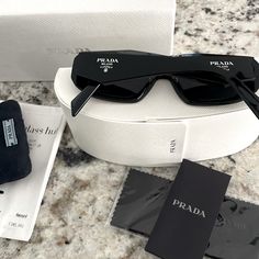 Prada Sunglasses Pr17ws Blk, Gry 100% Authentic! Receipt, Box, Case Included. Used Condition. Always Kept In Cloth Pouch But Does Have Hairline Scratches As Shown In Photo But Not Visible While Wearing. Personally Think They Are In Good Condition As I’ve Hardly Worn Them. Ended Up Just Being Trendy For Me And Never Really Wearing Them. Purchased In 2022 For $433.00 Ask Questions If Needed Before Purchasing! Prada Sunglasses Women, Prada Black Sunglasses, Cloth Pouch, 27th Birthday, Prada Accessories, Prada Sunglasses, Birthday Wishlist, Christmas Wishlist, Prada Bag