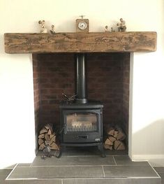 a wood burning stove sitting inside of a living room next to a fire hydrant