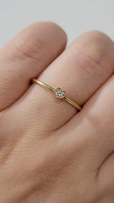 Diamond Heart-Shape Ring, Tiny 2MM Diamond Ring Women, Dainty Minimal Diamond Ring, Promise Ring, 14k Gold Stackable Ring, White, Rose Gold  Made in NYC - Custom Gold Color: Rose Gold, Yellow Gold, White Gold, in 14k  - Shank Width: 1.3mm - Diamond Shape: heart shape  - Number of Stones: 1 - Diamond Size: 2.2 mm - Total CTW:0.04 Ctw   - Diamond Color-Clarity: G-H / SI - Setting Type: Prong Setting  - Finish: high polish  We use only CONFLICT-FREE MINED DIAMONDS. This ring can be made in any ring White Gold Heart Ring With Single Diamond For Gift, Valentine's Day Single Diamond Ring In Fine Jewelry Style, Heart Shaped Single Diamond Fine Ring, 14k Gold Heart Ring With Single Diamond For Promise, Heart Shaped Single Diamond Ring Fine Jewelry, 14k Gold Stackable Heart Cut Heart Ring, 14k Gold Heart Ring With Single Diamond For Gift, White Gold Heart Ring With Single Diamond For Promise, Heart Shaped Single Diamond Ring