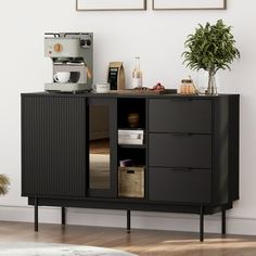 a coffee machine is sitting on top of a cabinet in a room with white walls