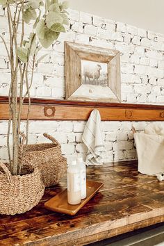 a wooden table topped with a potted plant