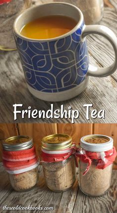 three jars filled with tea sitting next to each other on top of a wooden table