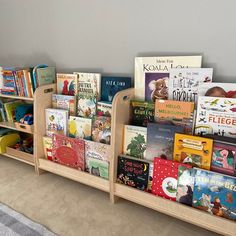 there are many books on the shelves in this children's bookcase, and one is empty