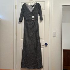 La Femme Gown. Size 10. Tags Attached Metallic Maxi Length Dress For Formal Occasions, Long Sleeve Gray Gown For Party, Formal Metallic Maxi Length Dress, Gray Maxi Dress For Party, Metallic Fitted Gown For Evening, Elegant Silver Maxi Evening Dress, Gray Long Sleeve Evening Dress For Party, Silver Fitted Dress For Dinner, Fitted Silver Dress For Dinner