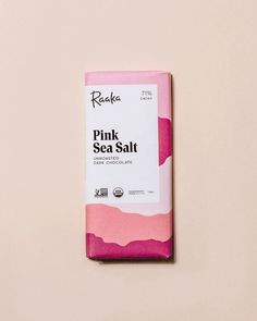 a pink sea salt bar on a white surface with the words pink sea salt written in black