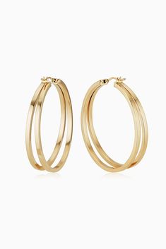 Inspired by the lines of a river, two square tubes run parallel in our Hudson Hoops. Offering a classic shape, they emobdy timeless elegance, while their open double hoop design gives them a modern edge. Metal: 14 Karat Yellow Gold Weight: 3.6 grams Dimensions: 2mm Tube, 35mm Inner Diameter Construction: Tubing, Latch Closure Origin: Crafted in Arezzo, Italy Classic Polished Hoop Earrings For Evening, Classic Hoop Earrings For Evening, Classic Evening Hoop Earrings, Arezzo Italy, Hoop Design, Timeless Elegance, Nordstrom, Yellow Gold, Italy