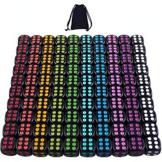 a large array of multicolored dots on a white background with a black bag behind it