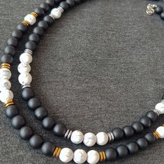 Welcome to our exclusive collection of handmade White Howlite and Matte Onyx necklaces, meticulously crafted for both men and women who appreciate the beauty of natural gemstone jewelry. Each necklace in our collection is expertly handcrafted using premium quality White Howlite, Matte Onyx, and Hematite beads, complemented with elegant silver or gold accents, resulting in a stunning piece that exudes sophistication and style. Materials Used in the Necklace Choker and DETAILS; - The Necklace You Gold Boho Necklace, Beaded Necklace For Men, Necklace String, Choker Necklace Silver, Howlite Necklace, Handmade Beaded Necklace, Handmade Beaded Necklaces, Natural Gemstone Jewelry, Onyx Necklace