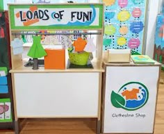 an assortment of toys are on display in a children's store, with the words loads of fun above them