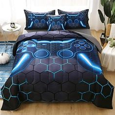 a bed covered in a blue and black comforter