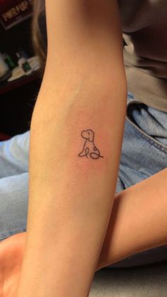 a person with a small tattoo on their arm