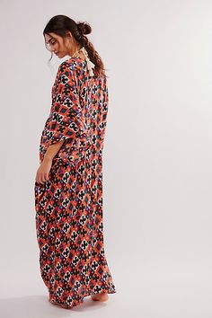 Billowy and breezy, vibrant and eye-catching, this so special kaftan is perfect for brunches, beach days, and everything in between. **Fit:** Maxi length, relaxed and oversized **Features:** Super mod, retro print, relaxed sleeves, pull-on style, deep-v neckline, ruched detailing, soft comfy fabrication **Why We | Groovy Baby Maxi Kaftan Dress by Free People Maxi Length Beachwear Cover-up For Brunch, Oversized Maxi Dress For Spring Vacation, Bohemian Bold Print Maxi Dress For Summer, Bohemian Summer Maxi Dress With Bold Print, Oversized Beachwear Maxi Dress For Beach Season, Spring Bohemian Kaftan With Abstract Print, Long Sleeve Maxi Dress With Abstract Print For Vacation, Bold Print Summer Beach Dresses, Patterned Tunic Maxi Dress For Vacation