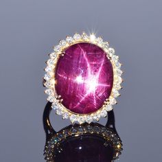 The Star of Bharany ring glistens like no other, with a beautiful star that shines through! This is a 27.62 carat one of a kind ruby that is surrounded by 1.26 carats of exquisite white diamonds. All set in 18k yellow gold. Size: 7 Weight: 13.1 grams Diamond Cuff Ring, Sapphire Antique Ring, European Cut Diamond Ring, Infinity Diamond Ring, Cognac Diamonds, Gold Diamond Band, White Sapphire Ring, Pave Diamond Ring, Halo Diamond Ring